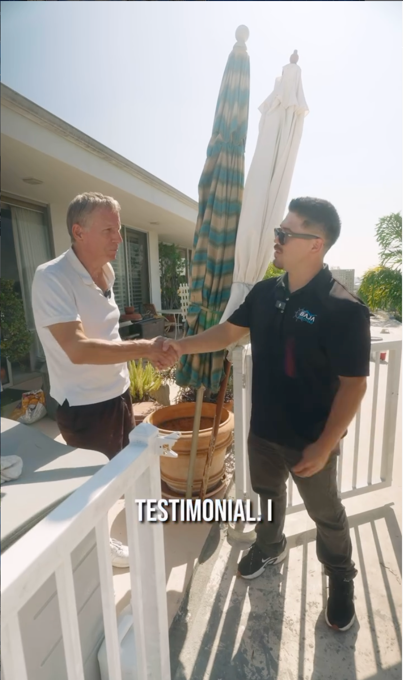 Baja Roofing team member with satisfied customer