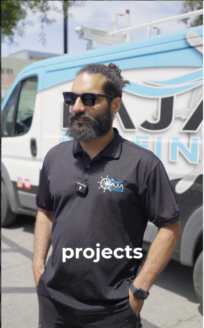 Baja Roofing team member with service van