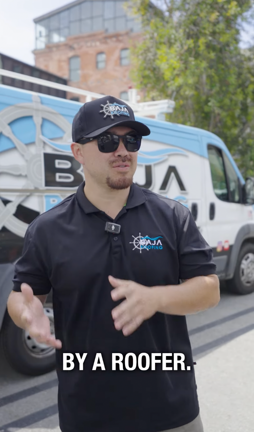 Baja Roofing team member with service van